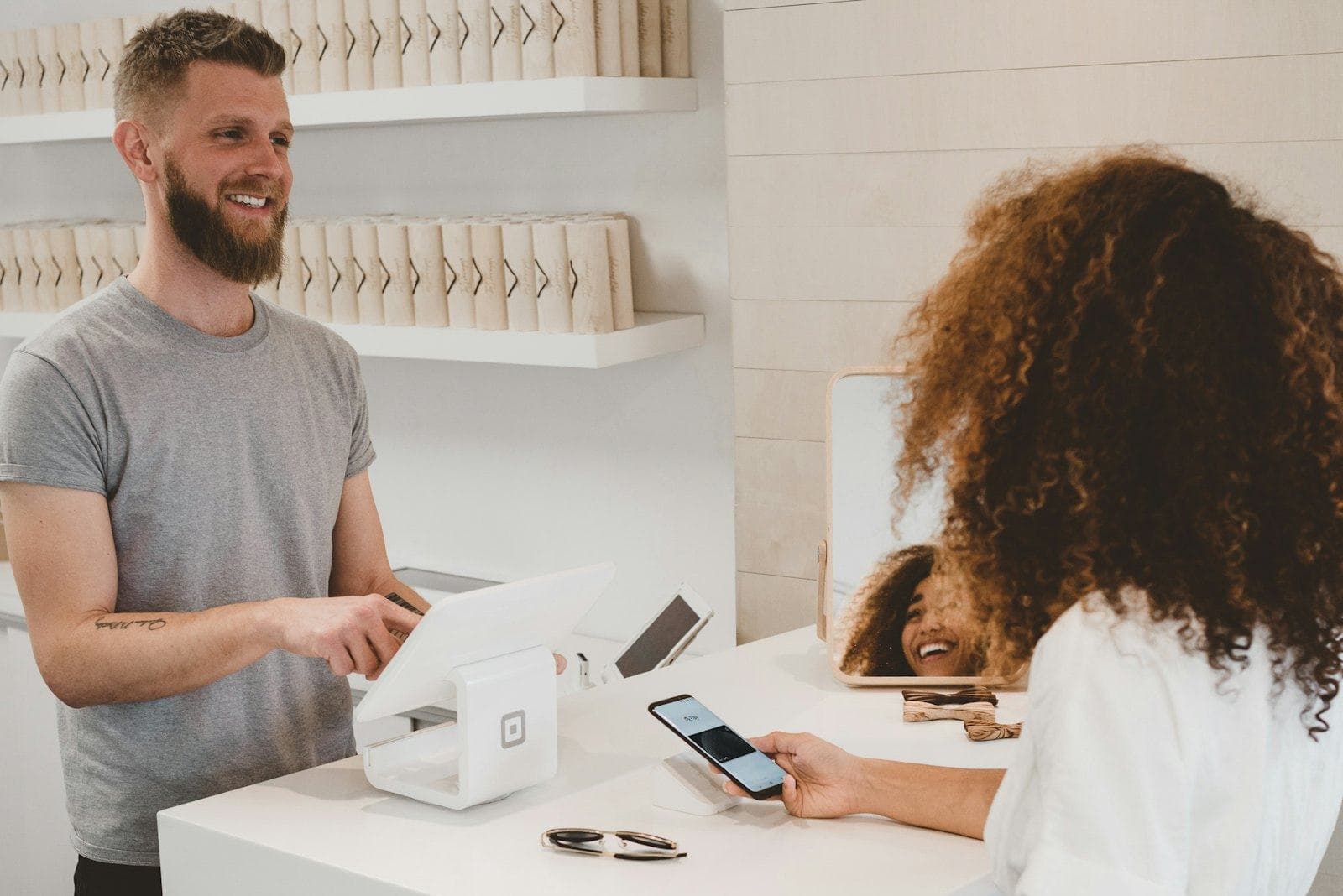 A customer paying at a café counter